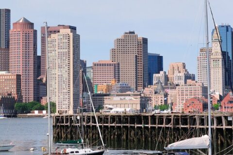 Arosa home care services in Boston, Massachusetts with caregiver assisting senior at home in a city setting