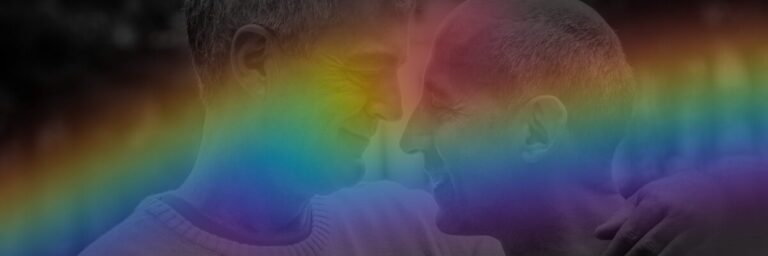 Two older men facing each other with a rainbow Pride overlay, representing LGBTQ+ senior care and aging with dignity.