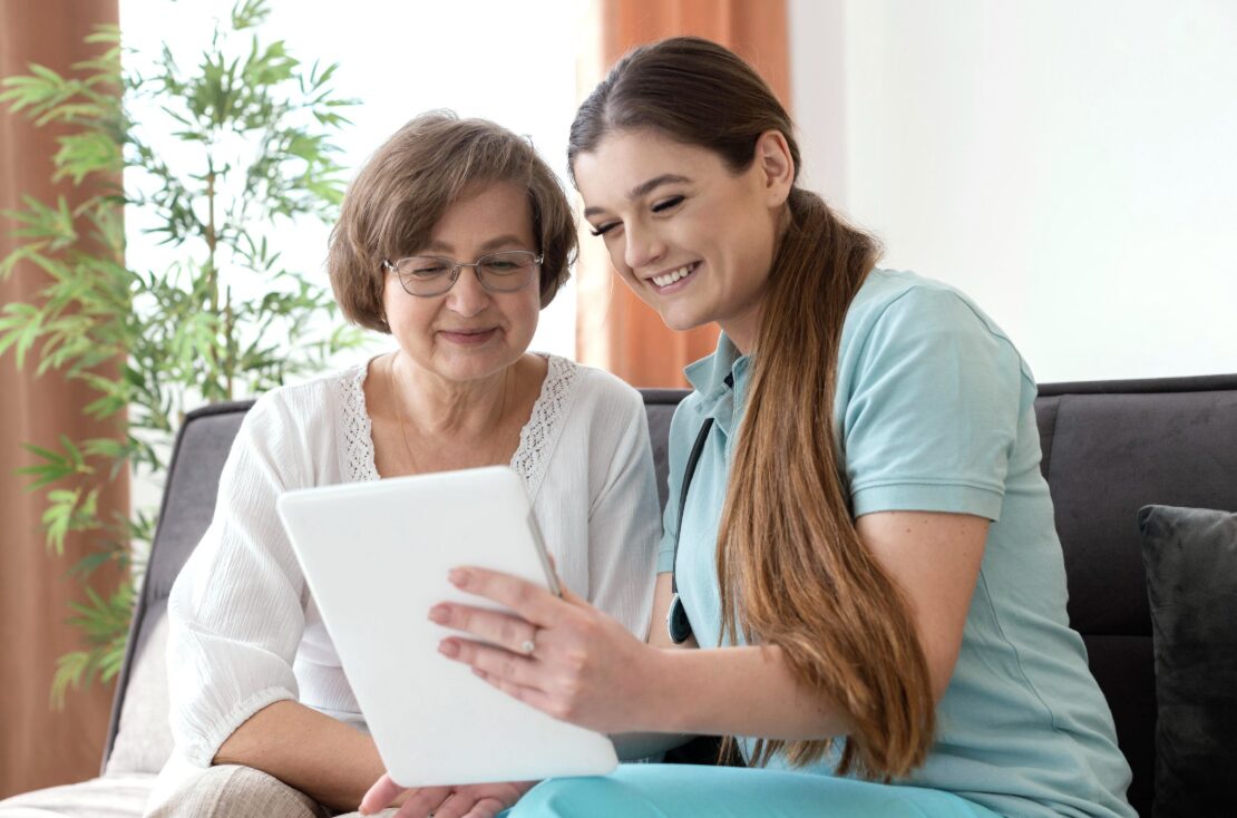 Arosa care manager and caregiver supporting an older adult at home