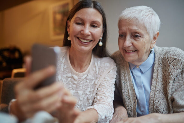 Care Manager speaking with an older adult during an in-home care planning consultation.